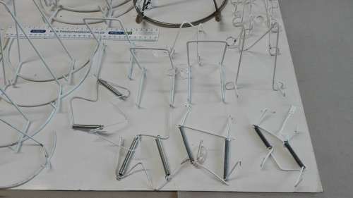 box of plate stands, 29, some are chipped and peeling, and four plate hangers, as per photos