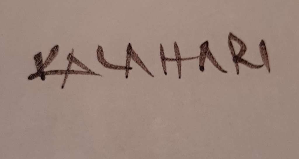 KALAHARI POTTERY WALL PLATE DEPICTING AFRICAN WOMAN