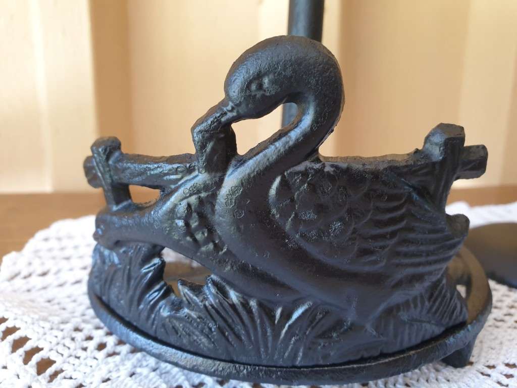 CAST IRON ROLL HOLDER AND TWO CANDLE HOLDERS