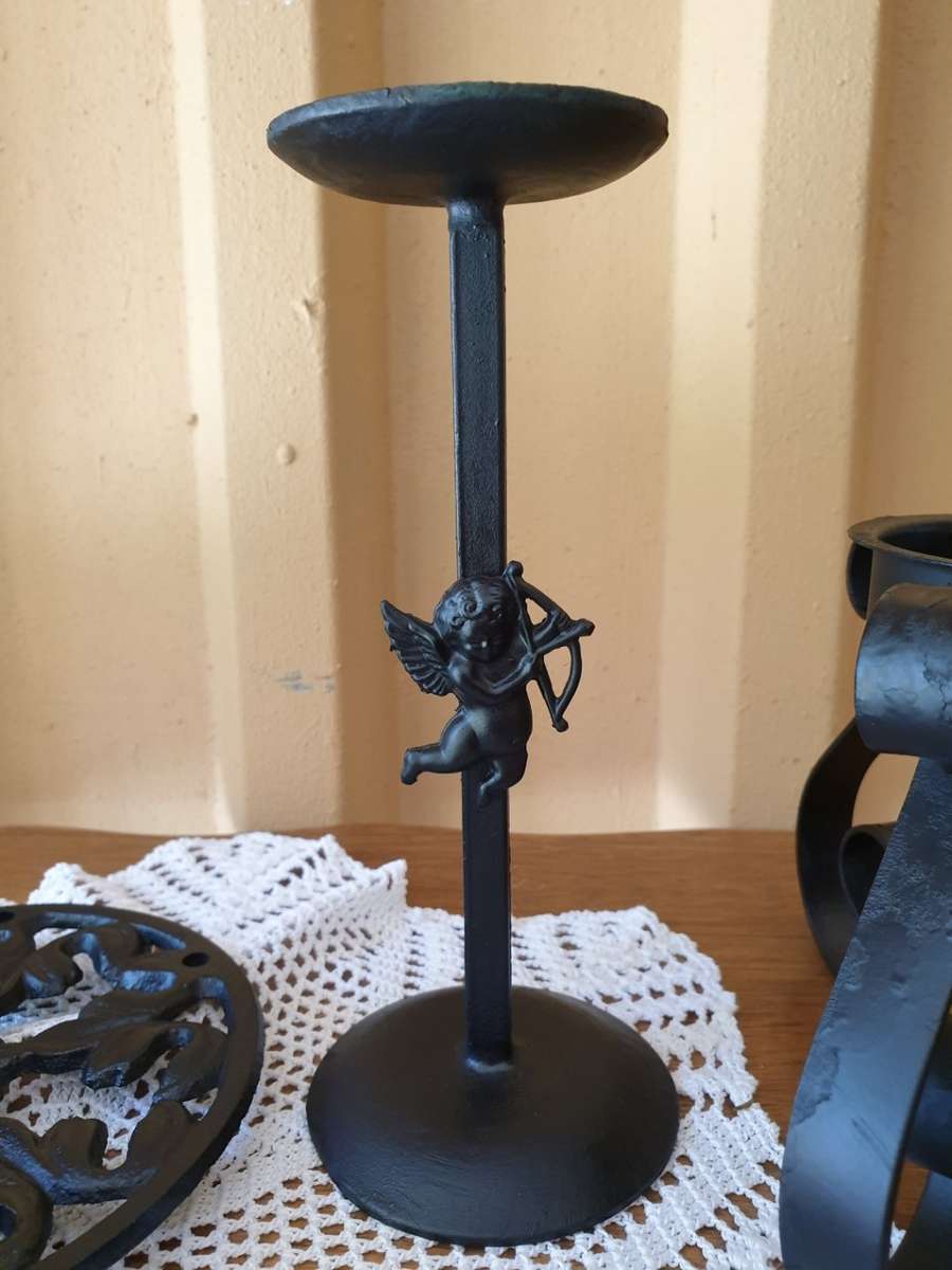CAST IRON ROLL HOLDER AND TWO CANDLE HOLDERS