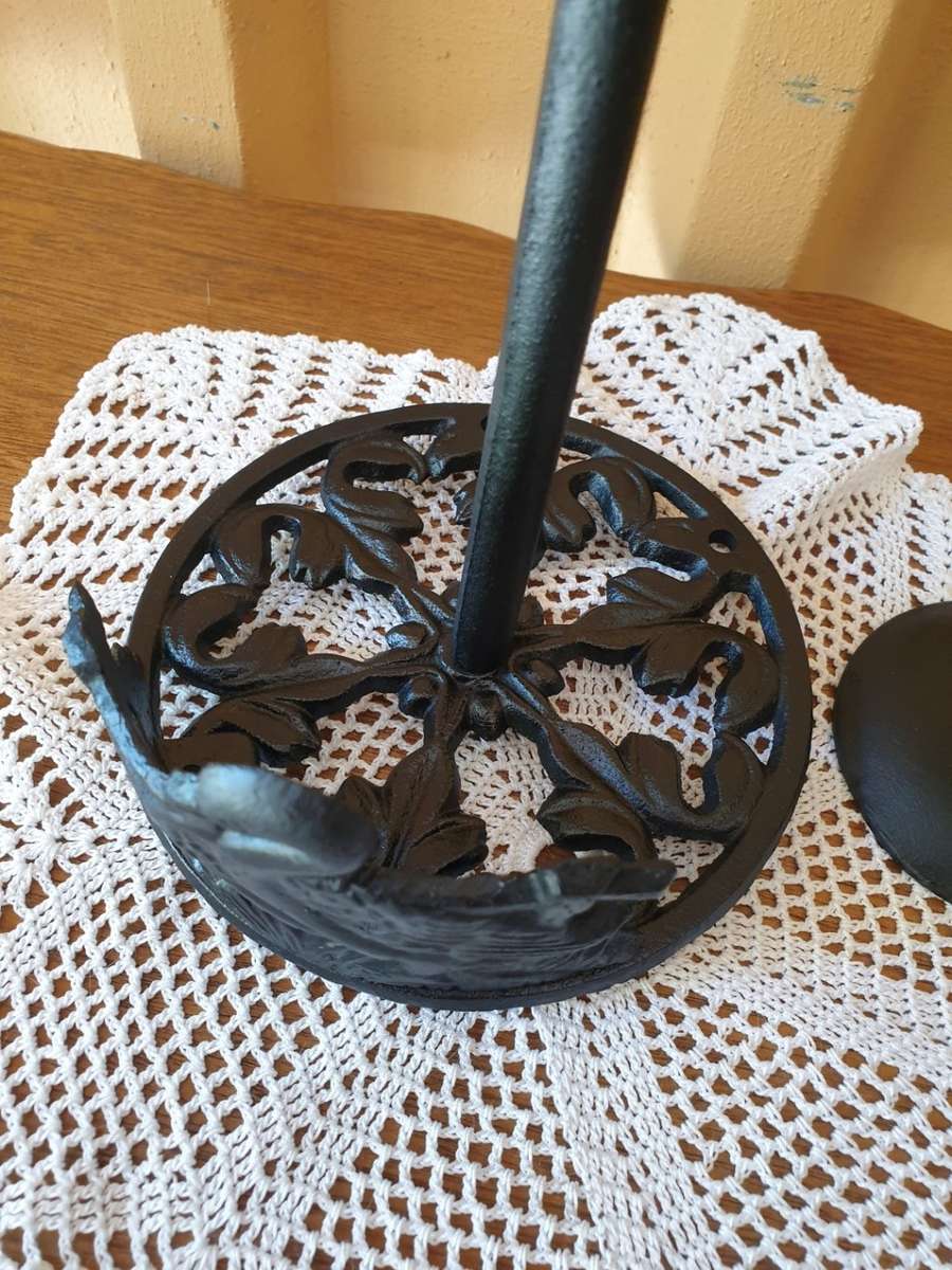 CAST IRON ROLL HOLDER AND TWO CANDLE HOLDERS