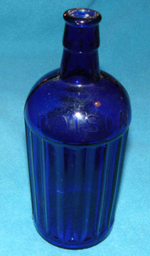 A Blue Circular Ribbed Poison Bottle