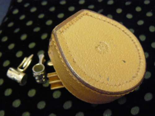 LEATHER BOX AND SOME CUFF LINKS