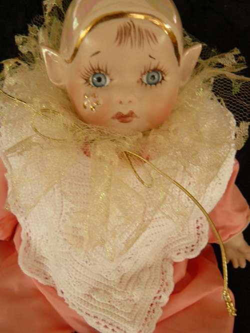 HAND PAINTED COLLECTABLE PIXIE - COMES WITH A HAND CHROCETED BIB, BECAUSE SOMETIMES HE GETS A BIT ME
