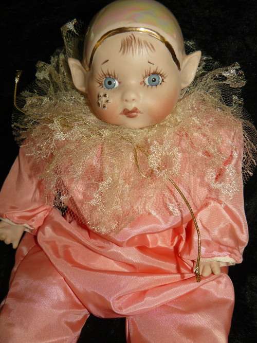 HAND PAINTED COLLECTABLE PIXIE - COMES WITH A HAND CHROCETED BIB, BECAUSE SOMETIMES HE GETS A BIT ME