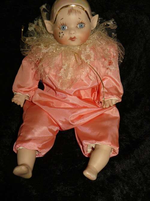 HAND PAINTED COLLECTABLE PIXIE - COMES WITH A HAND CHROCETED BIB, BECAUSE SOMETIMES HE GETS A BIT ME