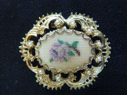 GOLD TONED BROOCH WITH FAUX PEARLS AND PETIT POINT FLOWER