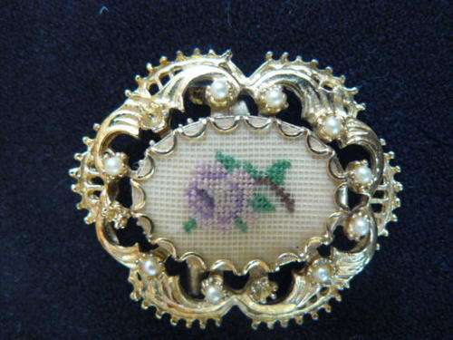 GOLD TONED BROOCH WITH FAUX PEARLS AND PETIT POINT FLOWER