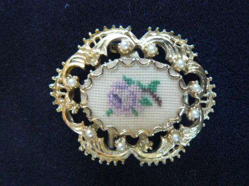 GOLD TONED BROOCH WITH FAUX PEARLS AND PETIT POINT FLOWER