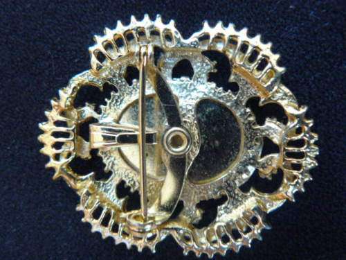 GOLD TONED BROOCH WITH FAUX PEARLS AND PETIT POINT FLOWER