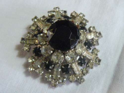 RAISED SLVER TONED BROOCH WITH BLACK STONED AND BLING