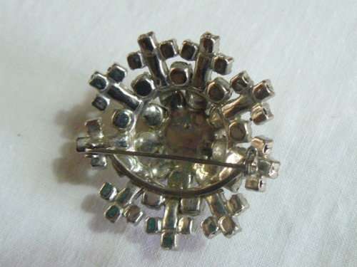 RAISED SLVER TONED BROOCH WITH BLACK STONED AND BLING