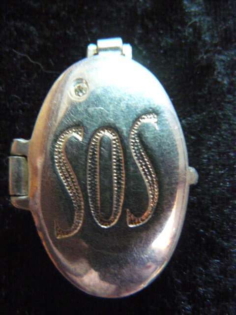 SOS SILVER TONED LOCKET - PENDANT