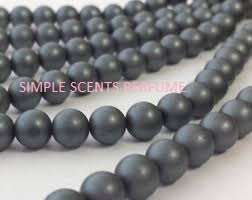 10MM WOODEN BEADS GREY  +- 100 PC S