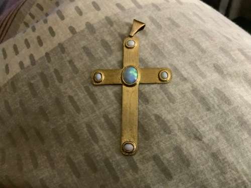 Gold cross pendant with opal