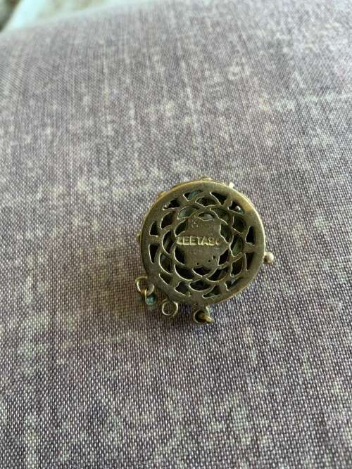 Necklace clasp part of pearl necklace