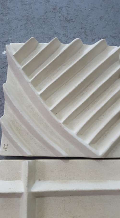 Unique plastered finish/cement type material. Wall hanging--great appeal,funky,modern!!