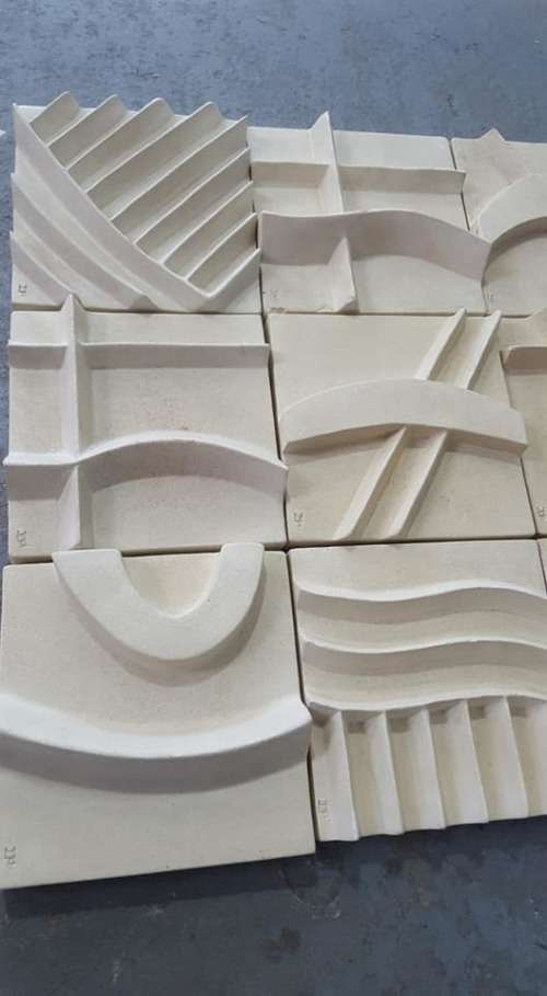 Unique plastered finish/cement type material. Wall hanging--great appeal,funky,modern!!