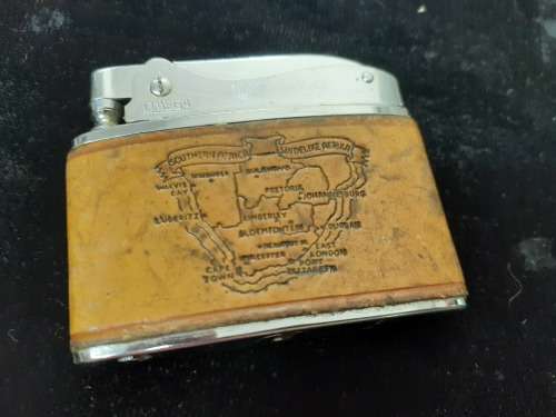 Omega engraved lighter