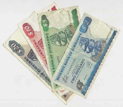 Lot of 4 early Zimbabwe banknotes - Decent condition