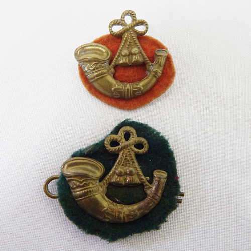 Lot of 2 different Royal Light Infantry badges with cloth backing