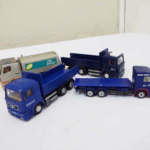Lot of four toy trucks