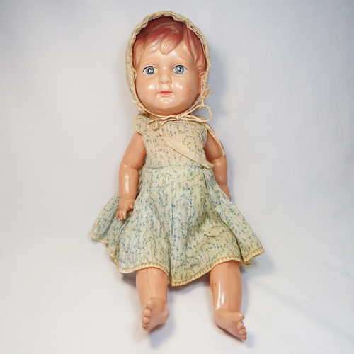 Cellulaid doll circa 1950`s with vintage dress - Some dents and marks