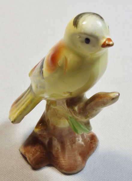 Yellow porcelain bird figurine
