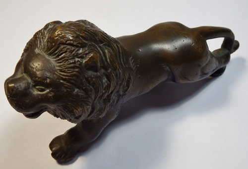 Antique brass lion figurine