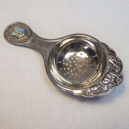 Naturesvalley tea strainer with elephant decor around edges