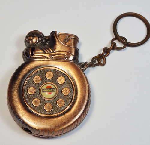 Vintage Nissan tyre and football lighter
