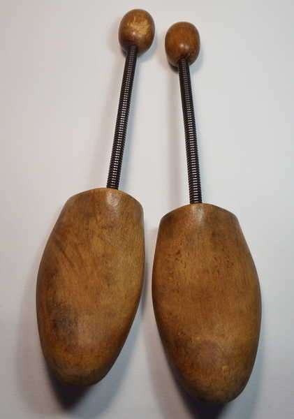 Pair of vintage wooden shoe stretchers with metal springs