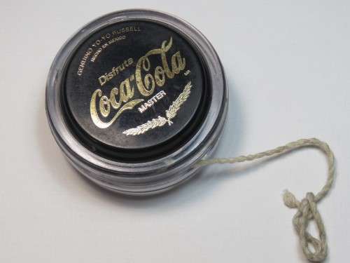Black and gold Coca-Cola master yo-yo