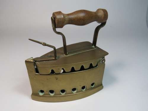Vintage brass coal sad iron with wooden handle