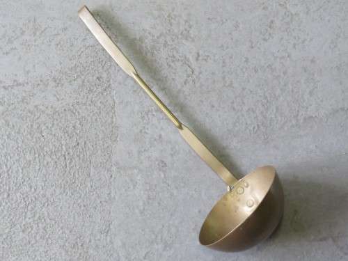 Yellow copper antique soup ladle