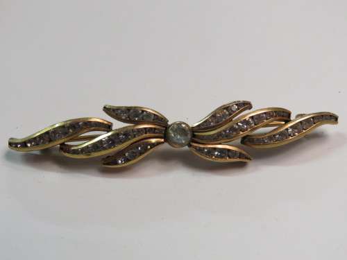 Vintage gold color brooch with diamante stones