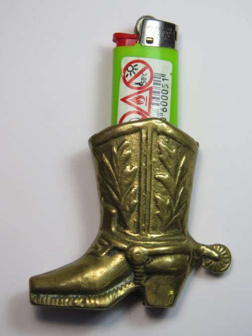 Vintage brass cowboy boot lighter holder