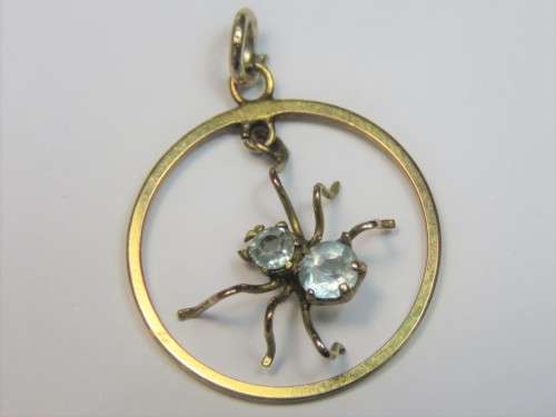 9kt Gold spider pendant with 2 light blue glass stones - Weighs 1.0 grams