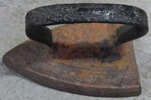 Antique cast iron sad iron door stopper