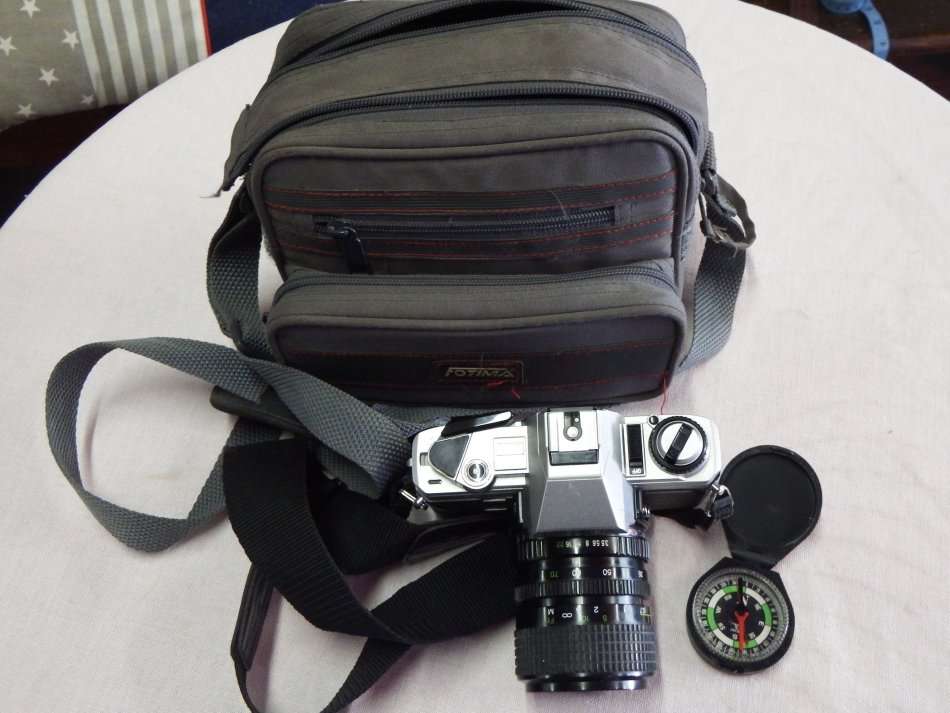 Minolta X-300 35mm camera with Cosina 35-70mm lens f 1:3.5-4.5 in camera bag