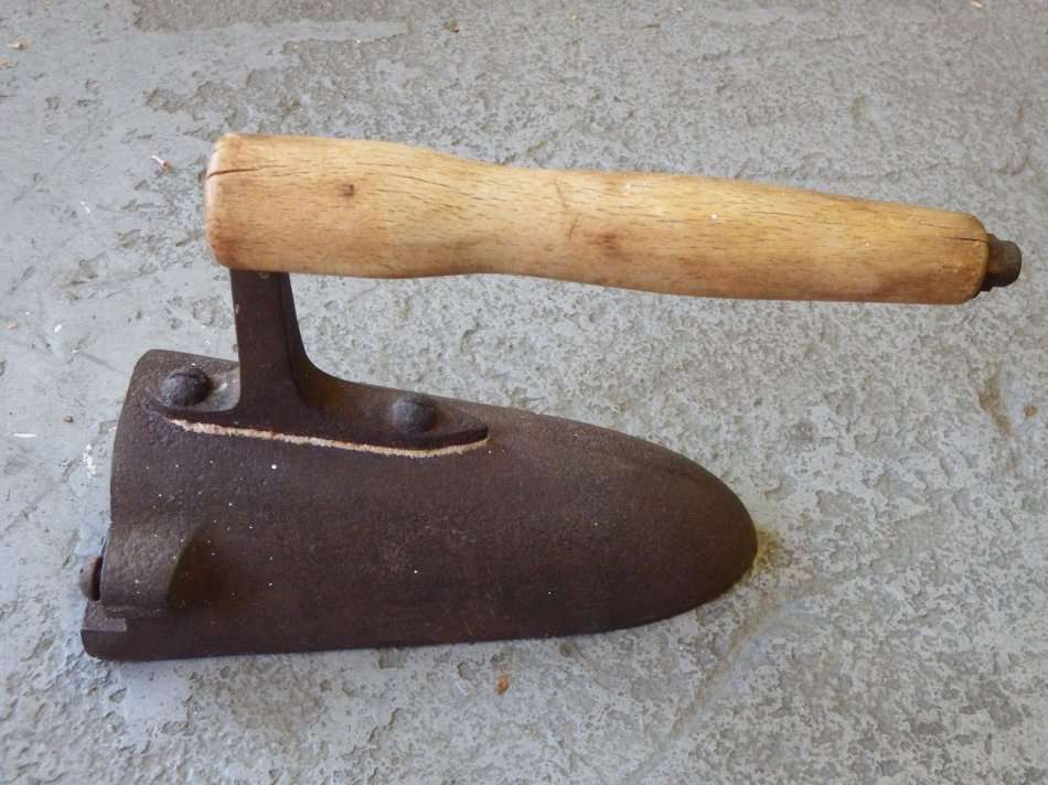 Antique cast iron charcoal sad iron with wooden handle