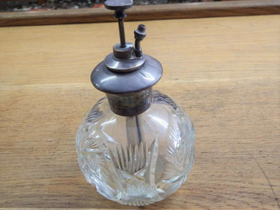 Vintage crystal perfume bottle with sterling silver top