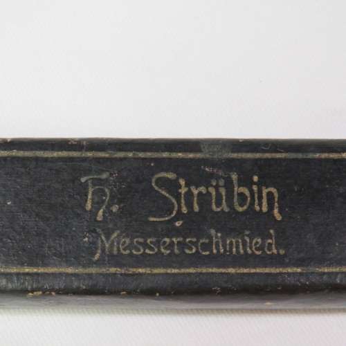 Vintage cut throat razor with chipped blade in box