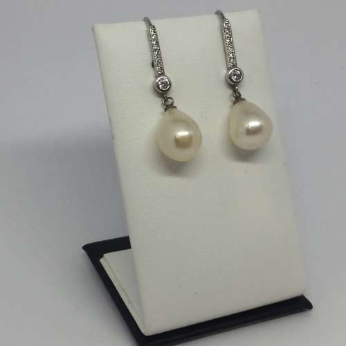 Pair of sterling silver pearl earrings with cubic zirconias - weighs 4.4g