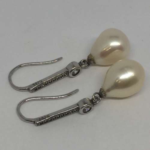 Pair of sterling silver pearl earrings with cubic zirconias - weighs 4.4g
