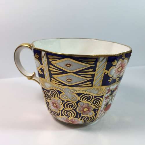 Royal Crown Derby porcelain trio with gold paint
