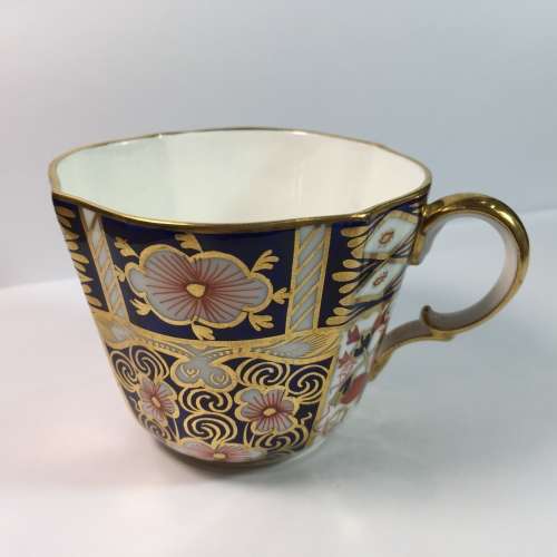 Royal Crown Derby porcelain trio with gold paint