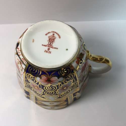 Royal Crown Derby porcelain trio with gold paint