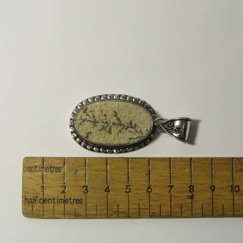 Sterling silver pendant with fossil inlay