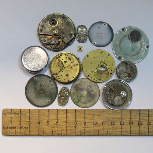 Lot of watch faces and broken movements